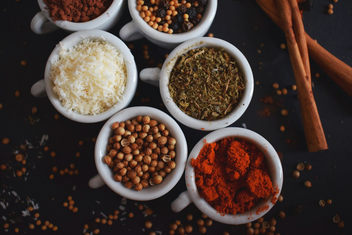 An assortment of colourful spices arranged in bowls
