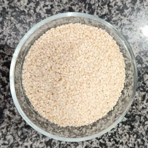 White sesame seeds in a glass bowl — سفید تل