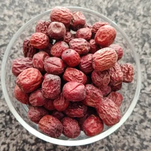 Whole dried Unnab jujube fruits in a glass bowl at Awaisia Pansar — عناب