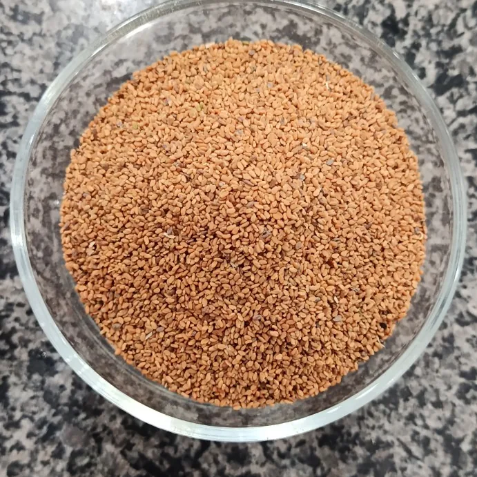 Small fenugreek seeds (Methi Dana) in a glass bowl at Awaisia Pansar — میتھی دانہ